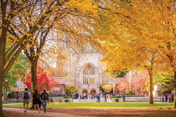 Students walk through college campus