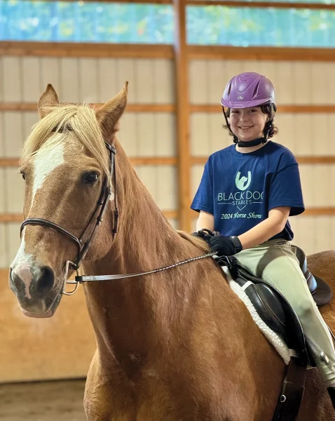 The young rider aboard Moose.