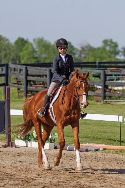 A young rider working to break bad riding habits.