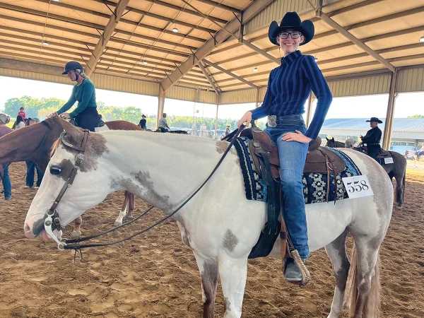 The young entrepreneur on her Paint Horse.