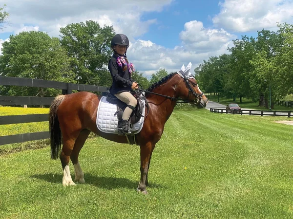 Grace on her first pony, Annie.