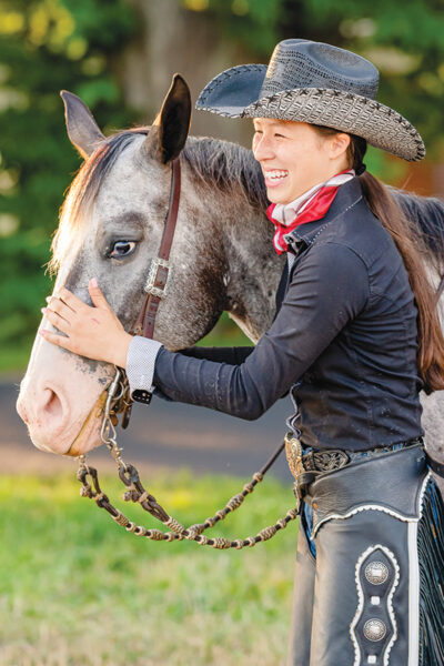 Kate Mih, a youth equestrian of color, with her POA Millie