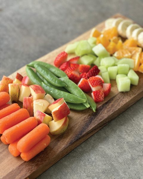 A tray of fruits and veggies.