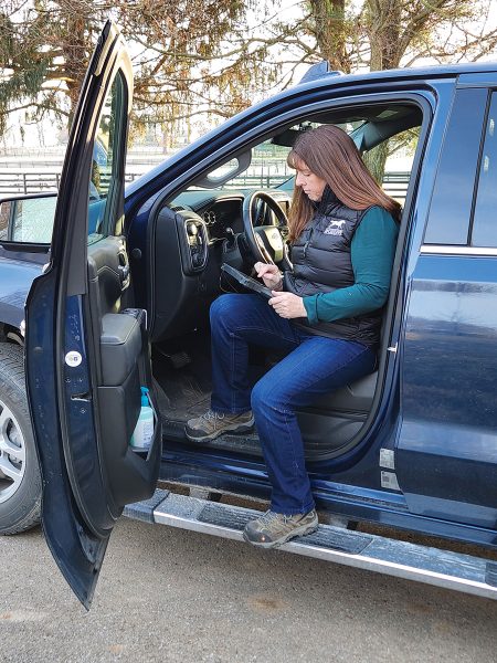 Equine nutritionist Amy in her truck on a farm call.