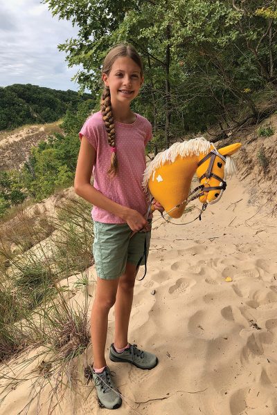 A young girl with her hobby horse