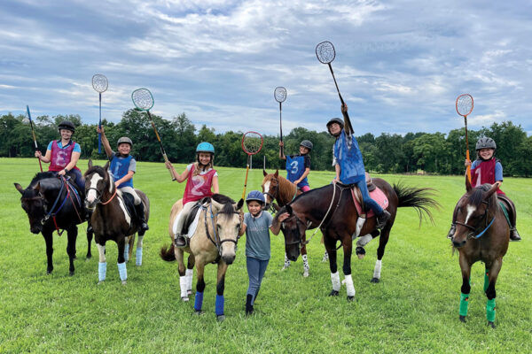 A celebrating equestrian team