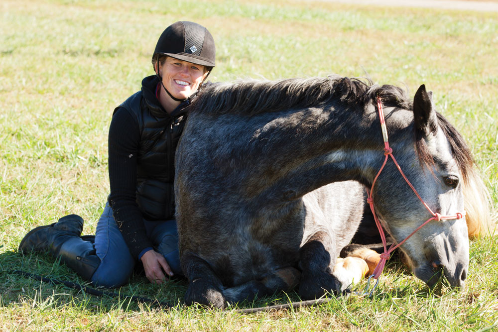 Elisa Wallace and her Mustang, Hwin, hanging out in the pasture