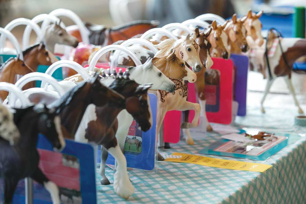 Model horses lined up at a model horse show