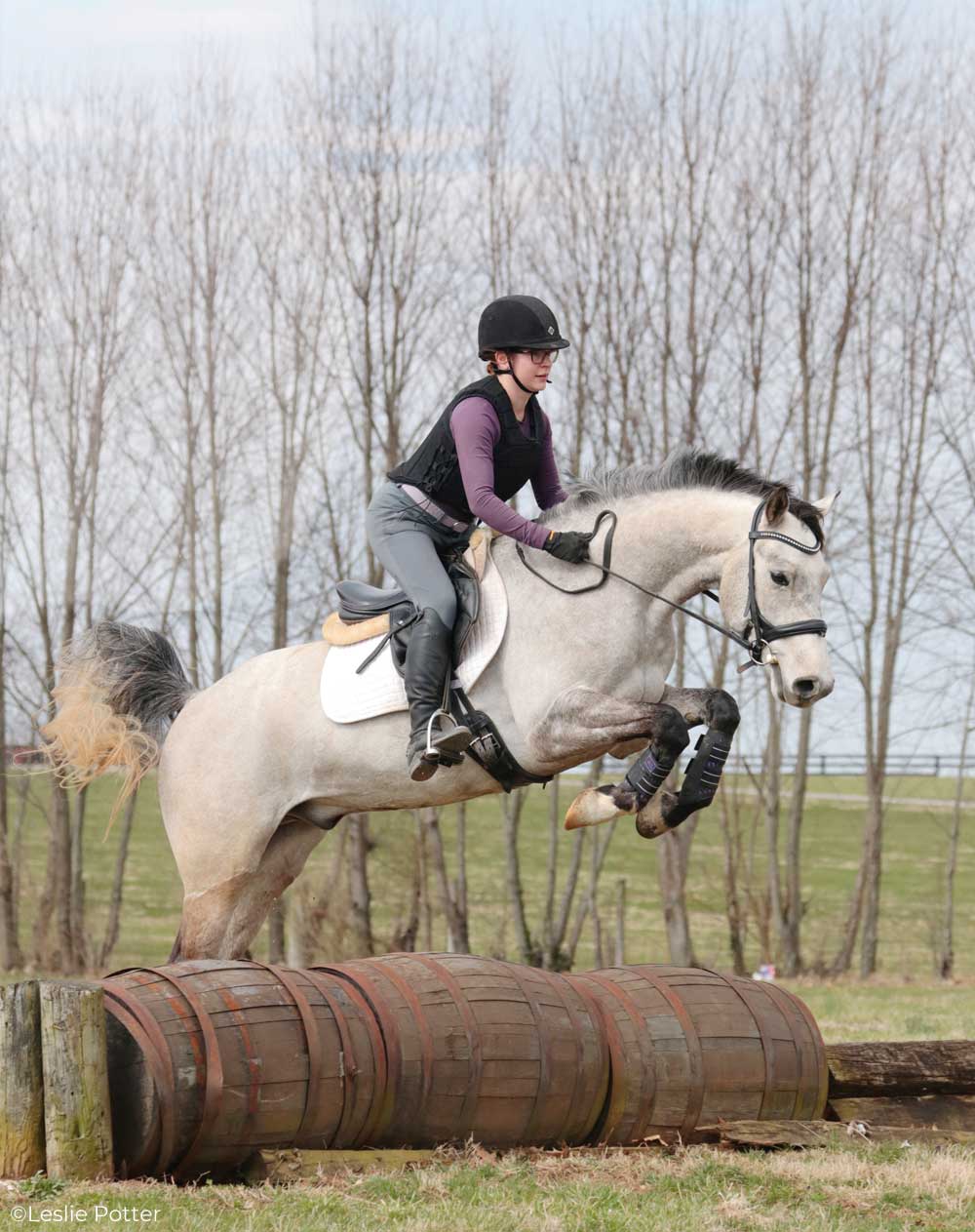 Jumping over cross-country barrels