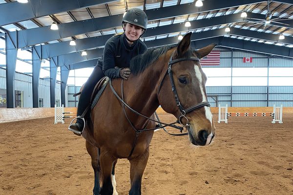 Student on one of Albion College's horses at the college's equestrian facility. 