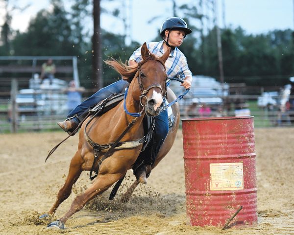Owen and Dunny competing in the barrel races at Williston Horsemans Park.