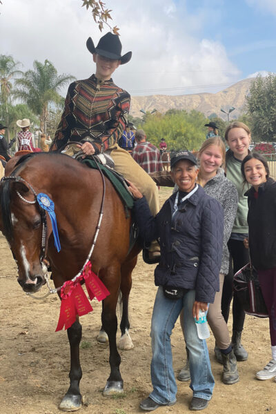 A group celebration photo after a successful horse show