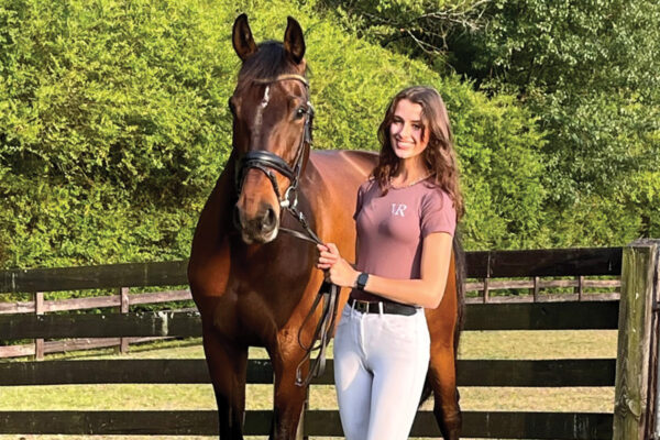 A young equestrian with her horse