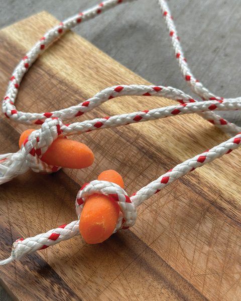 Rope tied around baby carrots.