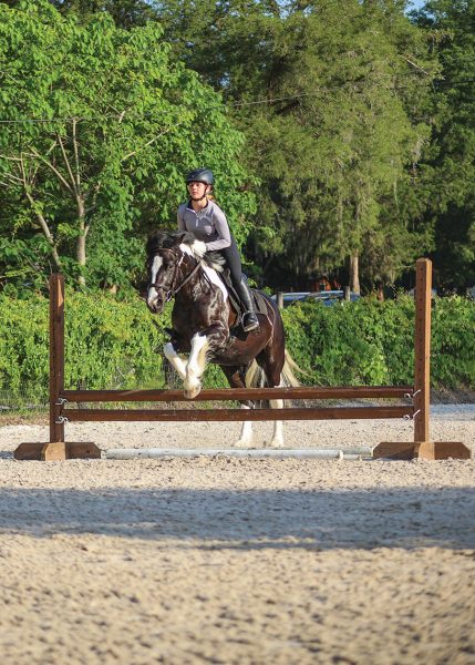 Kelsey and Duke jumping.