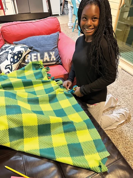 Cavannah working on her My Blanket project.