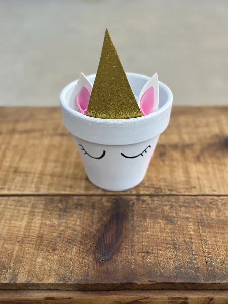 After adding the unicorn horn and ears to the DIY flower pot.