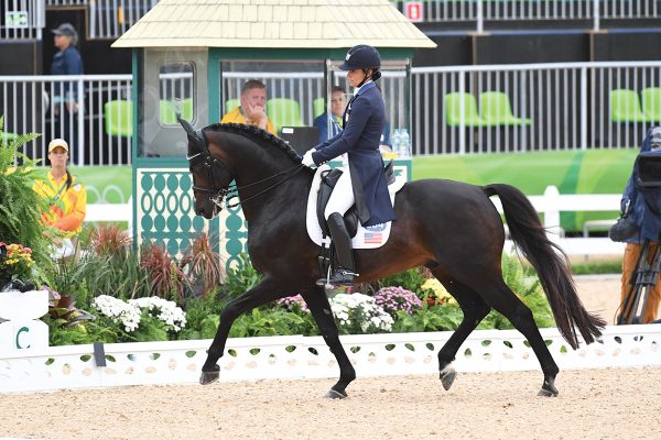 Olympic medalist Allison Brock performs a dressage test