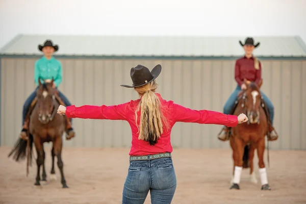 Ariel demonstrates two horse widths for passing another rider.