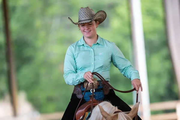 A smiling Western equestrian.