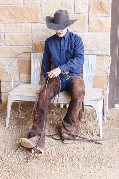 A rider practices how to use split reins