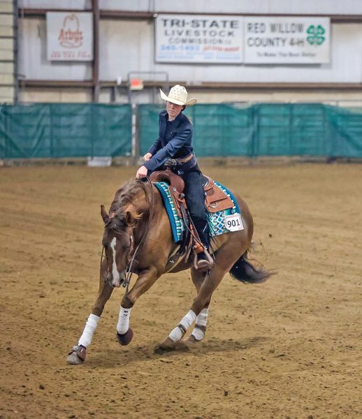 A youth competitor showing in reining.