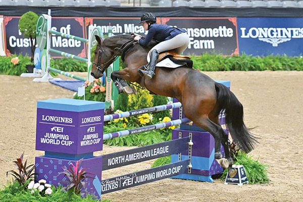 Savannah jumping at a show in preparation for Pony Finals.