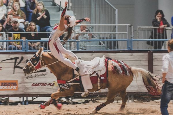 Trick riding at a rodeo