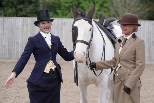 Displaying sidesaddle riding attire