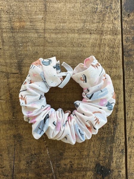 Sewing the ends together for the final touch on a DIY horsey hair scrunchie.