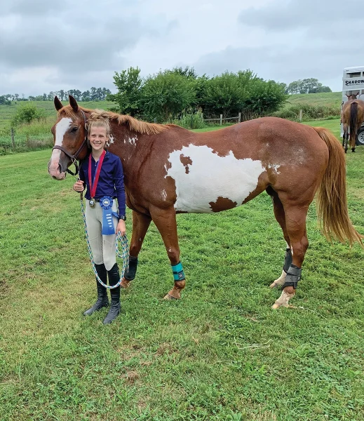Emma with her Paint mare, Fancy.