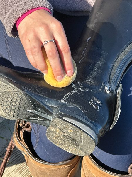 Cleaning and conditioning tall riding boots.