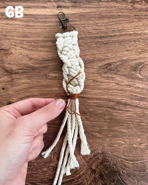 Pulling the embroidery thread tight.