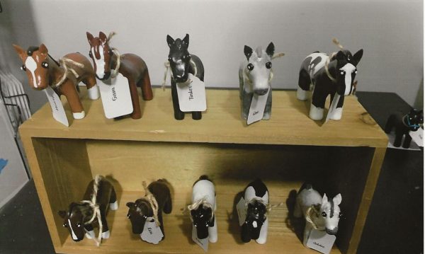 A collection of his miniature model horses on display.