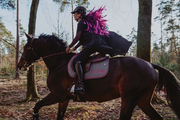 Danielle Goldstein Waldman riding with her flying feathers